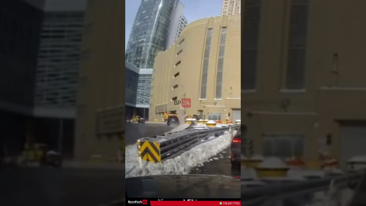Vehicle lost control & landed on a pile of snow outside the battery tunnel by entrance to manhattan.