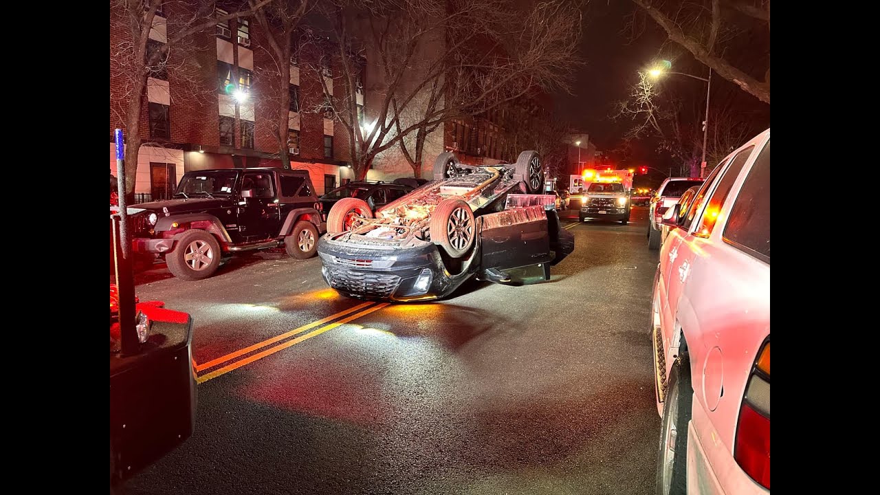Overturned Car Crash Causes Heavy Damage on Gates Avenue