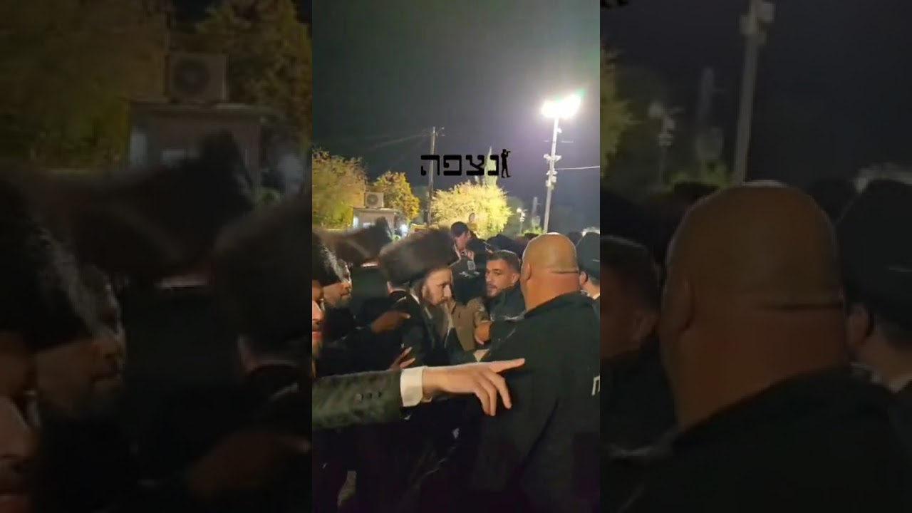 Israeli police ensuring the satmar Rebbe's secure exit through the crowds of thousands
