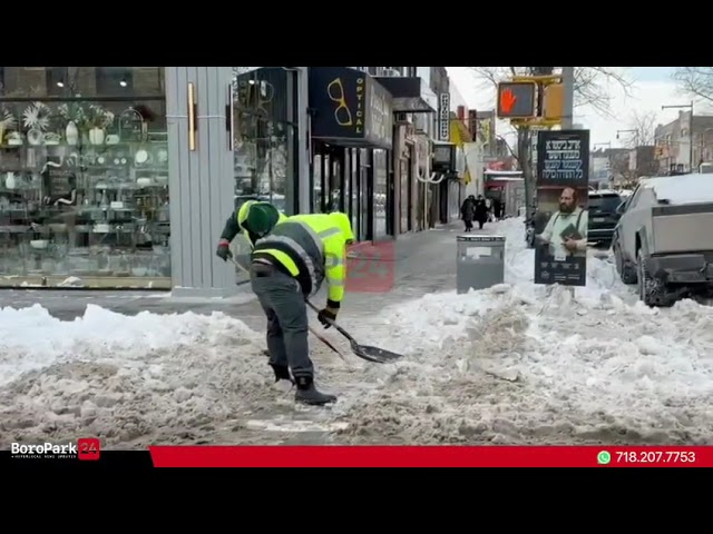 Sanitation Workers Were Seen Cleaning Street Corners at 48th St &13th Ave, Clearing Remaining Snow.