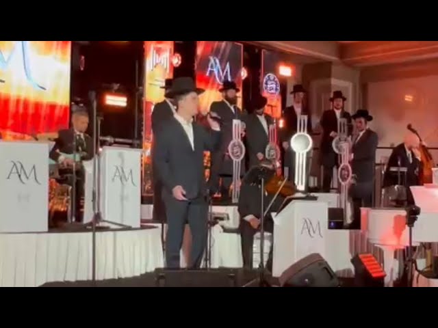 Former Child Soloist Yitzy Rosinger Taking The Microphone At The Bar Mitzvah Of His Brother Meir