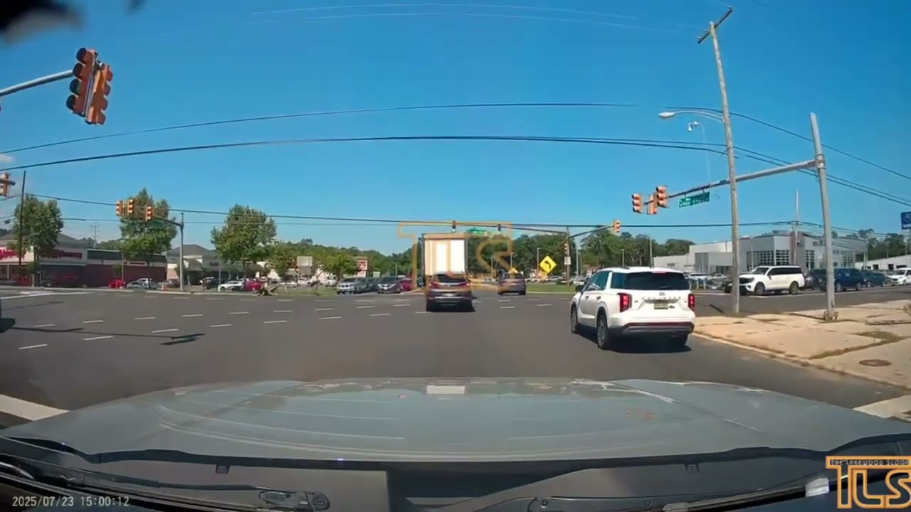 Two men on e-bike blow through red then tumbled off their off bike