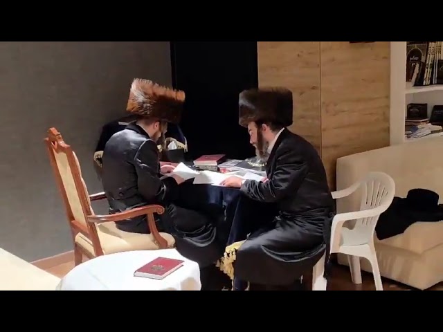 Sadigura Rebbe looking over important matters