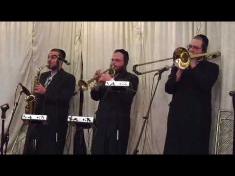 Mechoel Schnitzler with yumi lowv and the karpen brothers rocking by a wedding