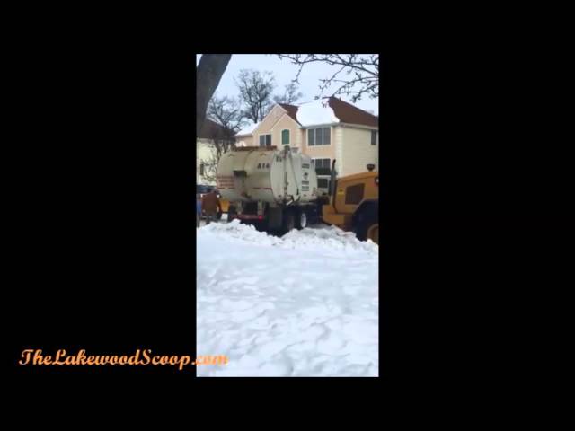 Garbage Truck Stuck in Lakewood Snow and Pulled Out