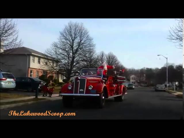 Santa Giving out Kosher Candy on Truck with Frum Firefighter