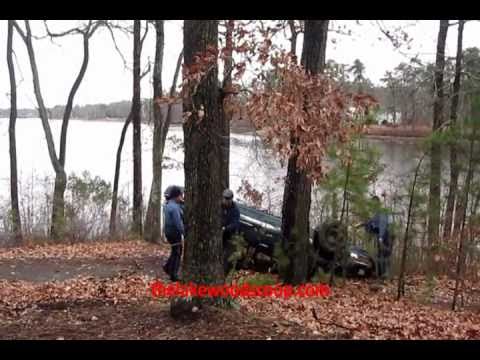 Car rolls down embankment overturned