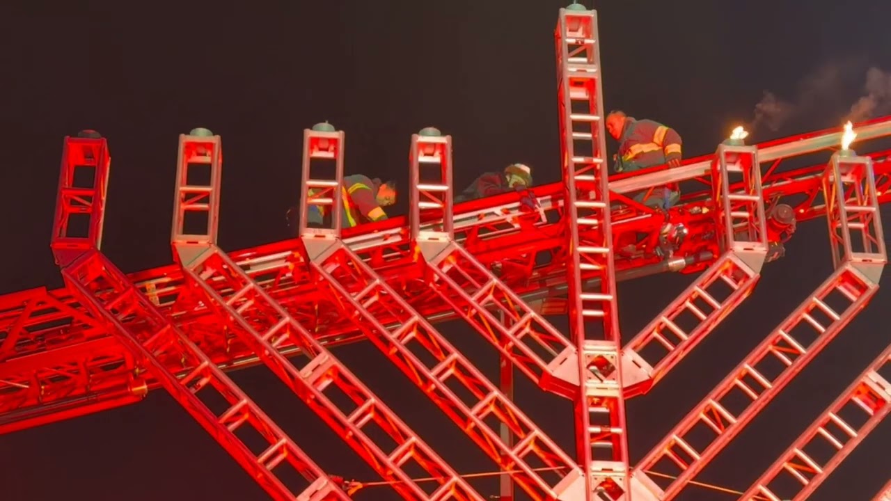 Lipa Schmeltzer Lights the Menorah on a Fire Truck Ladder in Monsey