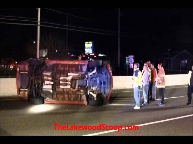 Overturned Vehicle Howell Route 9 - Emergency Personnel Flipping over Vehicle