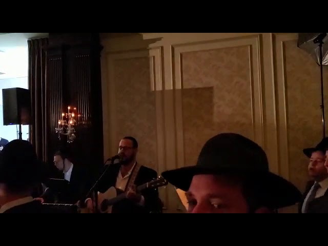 Moshe Groner singing Rabbi Shlomo Carlebach's "V'zoicher" at the Florans chupa.