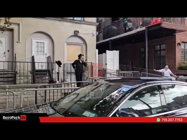 Preparations in front of the home of the Rachmastrivka Rebbetzin on 45th St for the Levaye