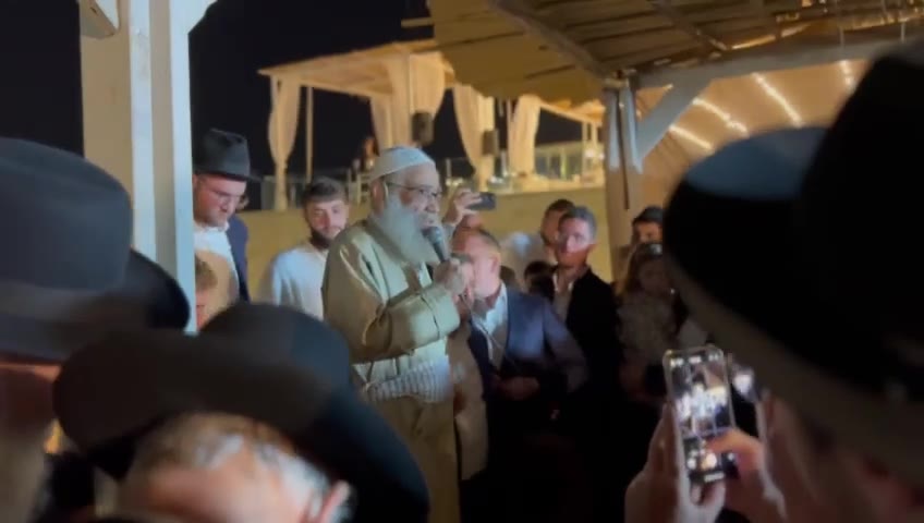 Harav Gamliel Rabinowitz at a Simchas Beis Hashoeva overlooking the Kosel